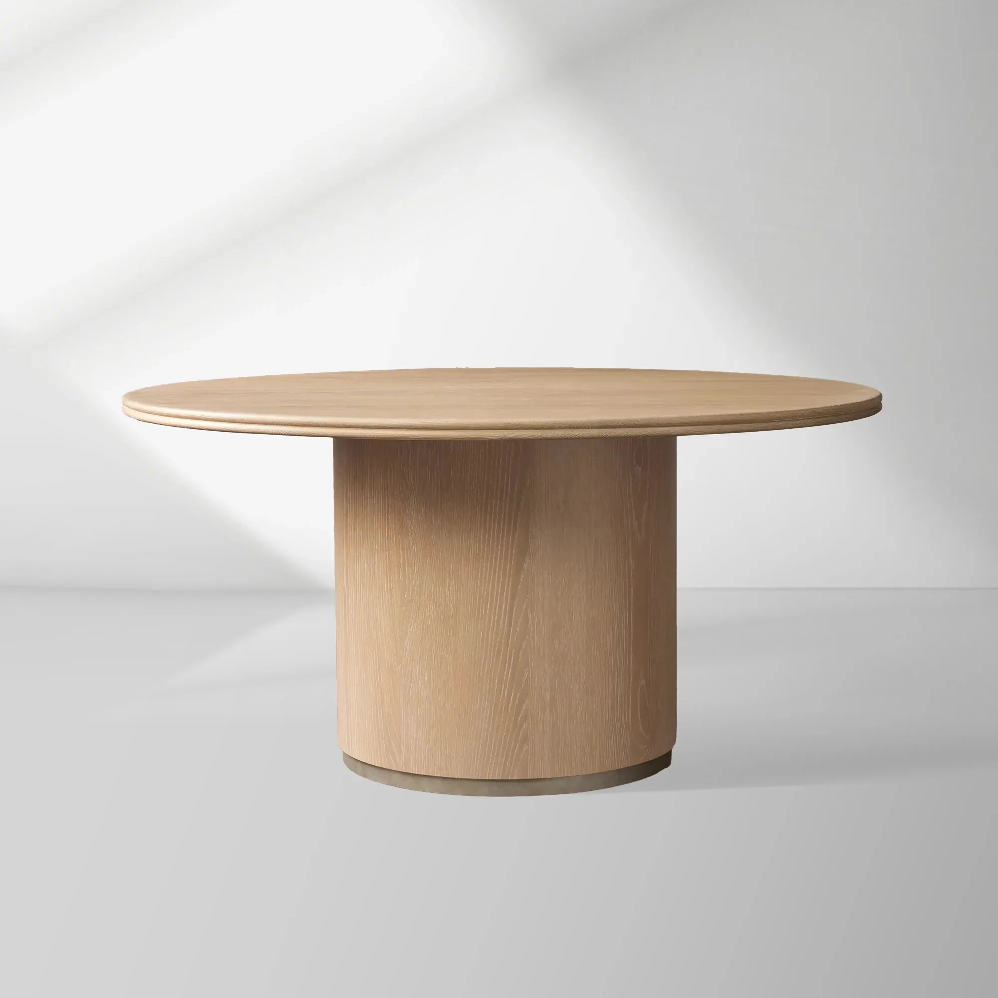Caden Round Dining Table with Wooden Top Sculptural Base & Antiqued Metal Plinth