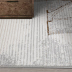 Tapis de zone moderne Puxina Layered Trace Calm avec motif esquisse déstructuré à ligne marron